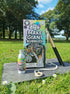Dr. Zigs bubble kit with bottle and wand on a wooden board outdoors