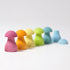 Colorful mushroom-shaped objects on a white background
