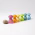 Colorful mushroom-shaped objects with a shell on a white background